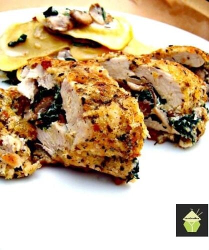 Herb Crusted Stuffed Chicken, a delicious juicy baked chicken breast stuffed with cream cheese and spinach and coated in crispy breadcrumbs.