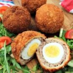 The Best Homemade Scotch Eggs, a popular British snack, perfect for a picnic, breakfast, or any occasion. Delicious eggs wrapped in sausage meat and coated in crispy breadcrumbs.
