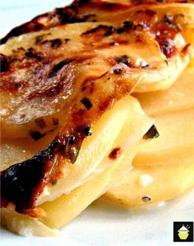 An EASY to make potato casserole dish using thinly sliced scalloped potatoes oven baked in a creamy sauce. Options for low fat ingredients too!