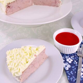 Strawberry and Coconut Ricotta Cheesecake. A delicious fluffy, creamy baked cheesecake with fresh strawberries and coconut in the filling and topped with a fresh strawberry puree. Very easy recipe too!