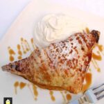 Easy Apple Spiced Turnovers. Crispy puff pastry packed with apples coated in cinnamon. Delicious eaten warm or chilled with a blob of ice cream too! Easy recipe, budget friendly and freezable.