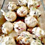 Aunt Nesey's Stuffed Shrimp Mushrooms, stuffed with shrimp and sausage in a creamy cheese sauce. Perfect as a starter or a main meal with a side salad and some nice bread!