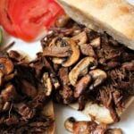Sweet and Spicy Pulled Beef. Slow cooked tender beef in a delicious sauce, simply served on a warm ciabatta roll with sauteed mushrooms, makes for a perfect meal!