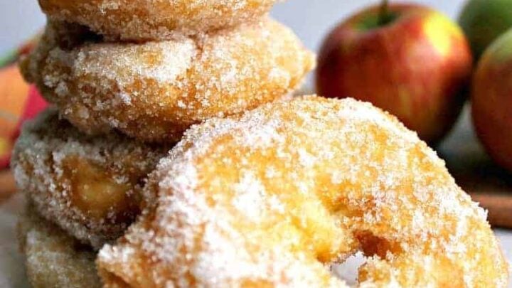 Apple Fritters. Yum! Slices of apple in a crispy light batter then coated in cinnamon sugar. Served warm with a drizzle of syrup, honey or a blob of ice cream.. makes for a perfect dessert! Quick and easy recipe too! | Lovefoodies.com