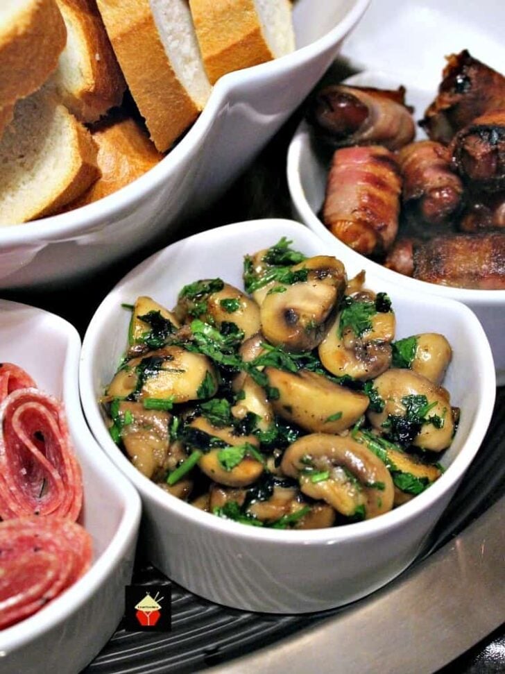 Champinones Al Ajillo, Spanish Garlic Mushrooms 2 Spanish Garlic Mushrooms is a wonderful Tapas dish, often served as party food. Easy and quick to make and fantastic flavors. Also great as a side dish! | Lovefoodies.com