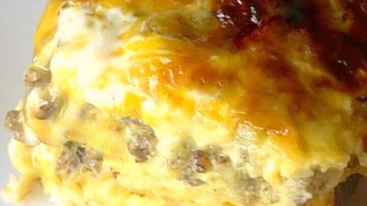 Deluxe Breakfast Casserole, a delicious oven recipe loaded with sausage, cheese, bacon, and eggs on a bed of hash browns. Easy to make comfort food at its best!