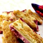 Strawberry Crescent Roll Cheesecake Bars. An incredibly easy and fuss free recipe with cream cheese and strawberry filling sandwiched between layers of pastry. This tastes amazing! | Lovefoodies.com