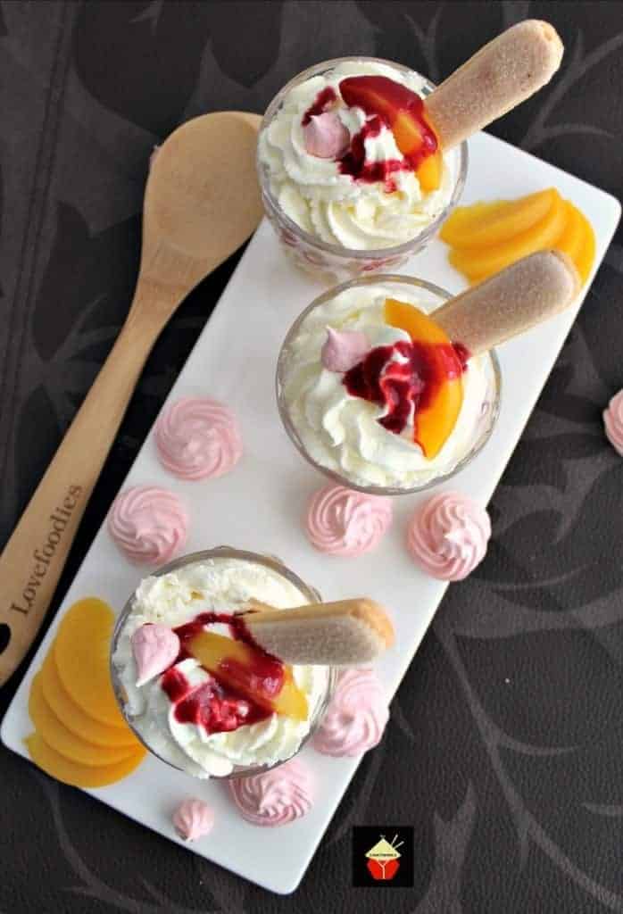 Amazing Peach Melba Trifle 5 Amazing Peach Melba Trifle! Dreamy layers of Lady Fingers, creamy vanilla pudding, peaches, raspberry sauce, whipped cream and meringue cookies. It can't get better than this! | Lovefoodies.com