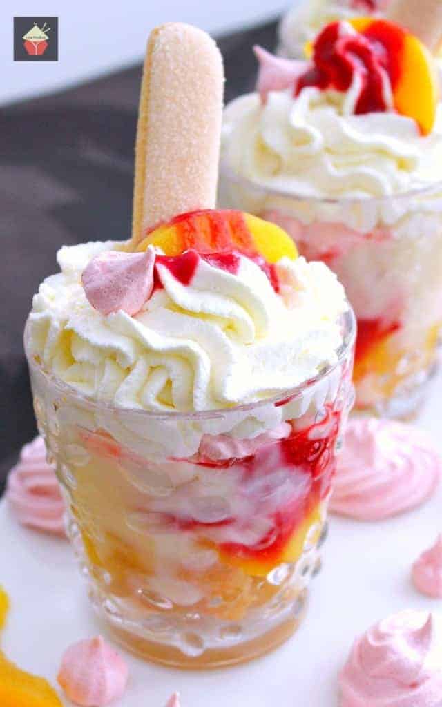 Amazing Peach Melba Trifle 4 Amazing Peach Melba Trifle! Dreamy layers of Lady Fingers, creamy vanilla pudding, peaches, raspberry sauce, whipped cream and meringue cookies. It can't get better than this! | Lovefoodies.com
