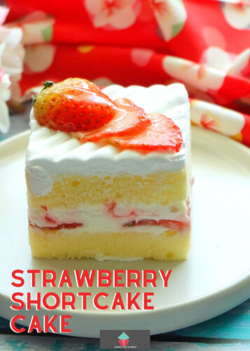 Strawberry Shortcake Cake, a wonderful refreshing cake packed with fresh strawberries and a whipped cream frosting.