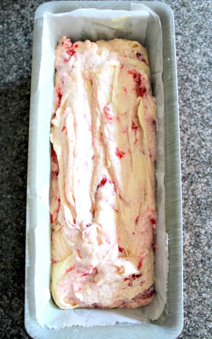Strawberry Pound Cake showing cake batter spread evenly in baking pan Strawberry Pound Cake showing cake batter spread evenly in baking pan