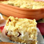 Delicious Apple Crumble Bars. These are absolutely out of this world! Chunks of apple filling on a lovely shortbread base and topped off with a delicious crumble. Really easy recipe too! | Lovefoodies.com