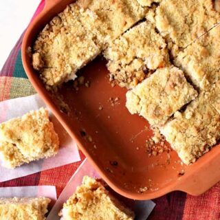 Delicious Apple Crumble Bars. These are absolutely out of this world! Chunks of apple filling on a lovely shortbread base and topped off with a delicious crumble. Really easy recipe too! | Lovefoodies.com
