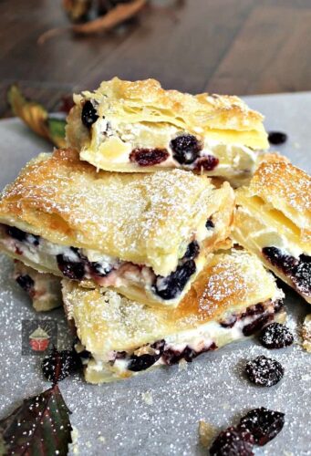 Apple and Cranberry Crescent Roll Cream Cheese Bars. An incredibly quick & easy recipe, sweet cream cheese puff pastry sandwiches loaded with juicy apples and cranberries makes for a perfect sweet snack