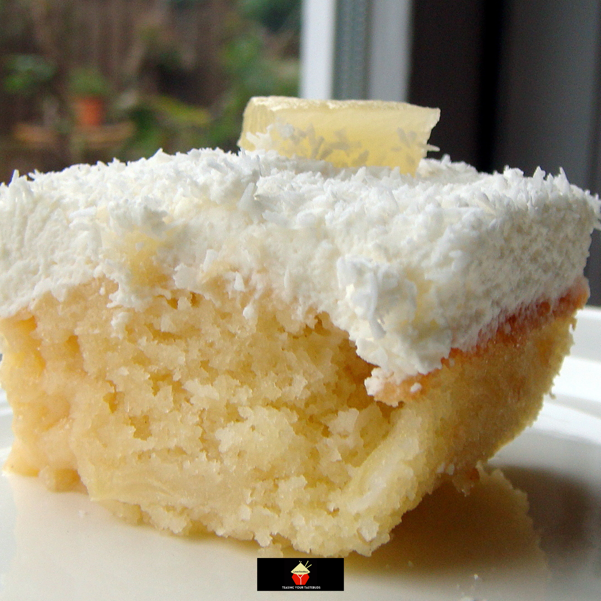 Pineapple and Coconut Poke Cake Lovefoodies