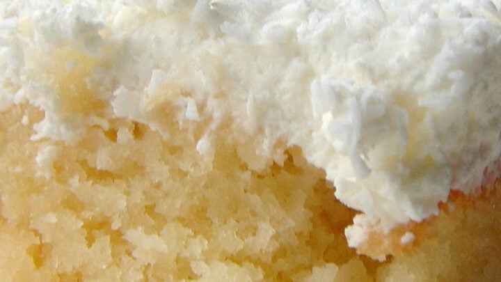 Pineapple and Coconut Poke Cake. A delicious pineapple combined with creamy coconut cake recipe, topped with fresh whipped cream and more coconut, making a soft and fluffy great tasting tropical cake