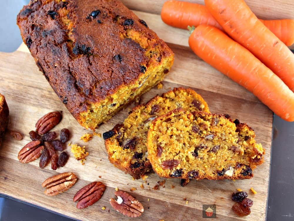 Spiced Pecan Carrot Cake! A delicious spiced cake made from scratch. Fluffy, soft and bursting with the flavors of Fall! Perfect for Thanksgiving, Christmas holidays!Ā #Cake #Thanksgiving #Christmas #Easter #Fall #Carrotcake #Winter