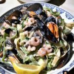 Creamy Garlic Seafood Pasta, a delicious quick and easy meal, with a delicious creamy white wine sauce.
