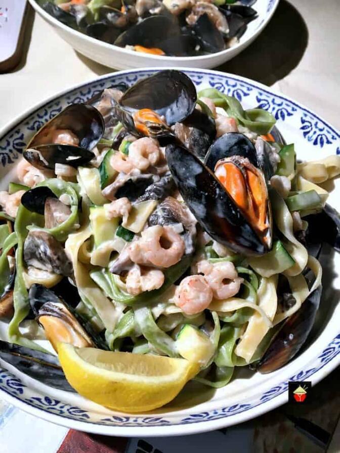 Creamy Garlic Seafood Pasta, with a delicious creamy white wine sauce.