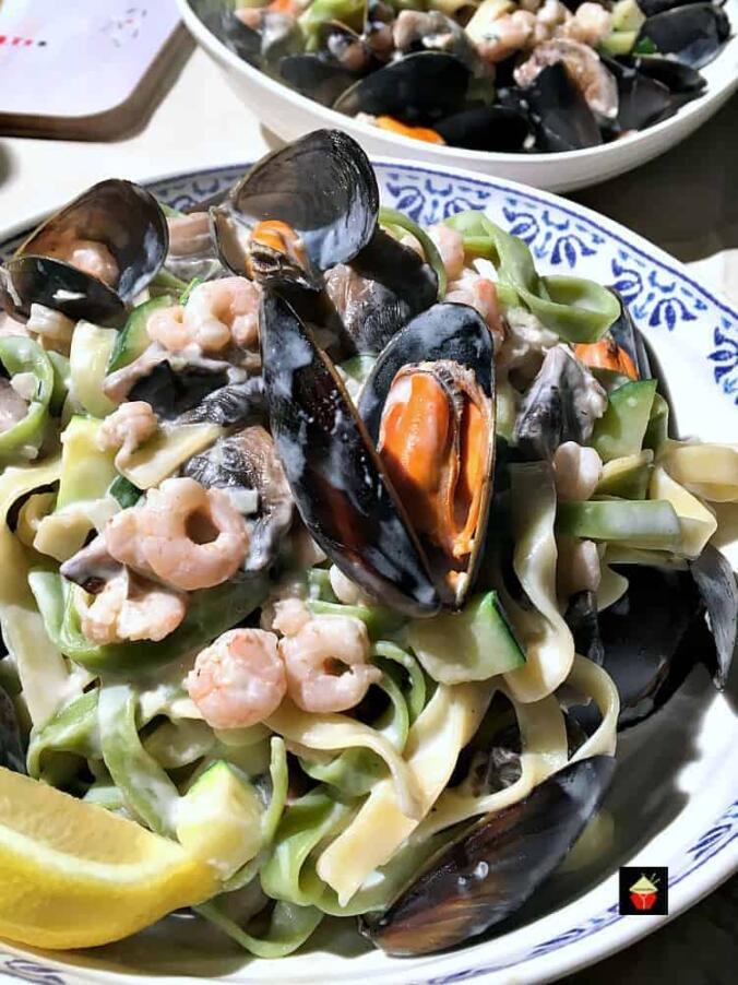 Creamy Garlic Seafood Pasta, with a delicious creamy white wine sauce.