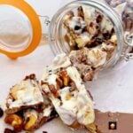 Irish Cream Chocolate Bark! A delicious chocolate treat loaded with cranberries, cookies and honey spiced nuts. Perfect for the holidays and great for gifts.