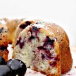 Cherry and Coconut Cake is a wonderful soft pound cake bursting with cherries in every bite! The flavor is out of this world!