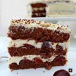 Authentic German Black Forest Cake, Schwarzwalder Kirschtorte is a delicious cake famous in Germany. Layers of chocolate cake, black cherries, and kirsch. Perfect for a party!