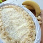 Easy Banana Cream Cake Trifle is amazing! Delicious layers of creamy custard, bananas and homemade banana bread, topped off with freshly whipped cream and a sprinkling of white chocolate. Simply delicious!