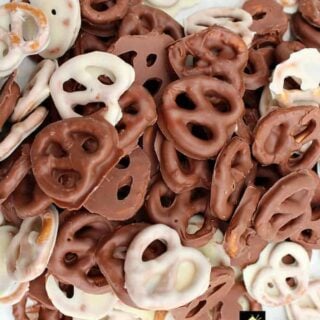 Easy Chocolate Party Pretzels are a great snack made up of delicious crunchy salted pretzels and a variety of chocolate. Once you start eating these you can't stop!