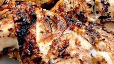 Flattened Moist BBQ Garlic and Lemon Chicken with a delicious marinade to give you juicy chicken every time. Easy instructions of how to cut a whole chicken into portions.
