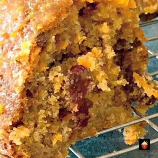 Easy Cranberry and Orange Carrot Cake! A delicious cake made from scratch with a lovely orange glaze. Fluffy, soft and bursting with the flavors! Perfect breakfast, brunch or to have with a coffee!