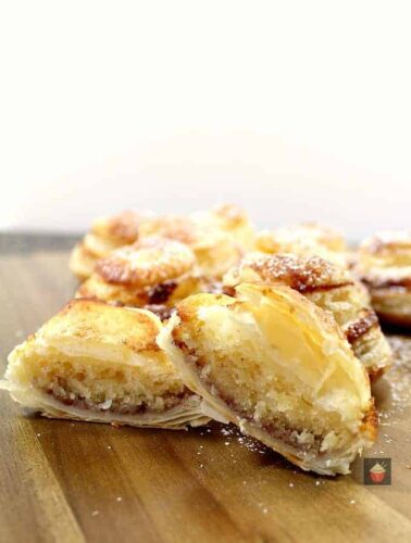 Mini Frangipane tarts are delicious almond cake filled mini tarts in a crispy puff pastry case. Delicious served warm from the oven or cooled with a blob of ice cream or fresh whipped cream!