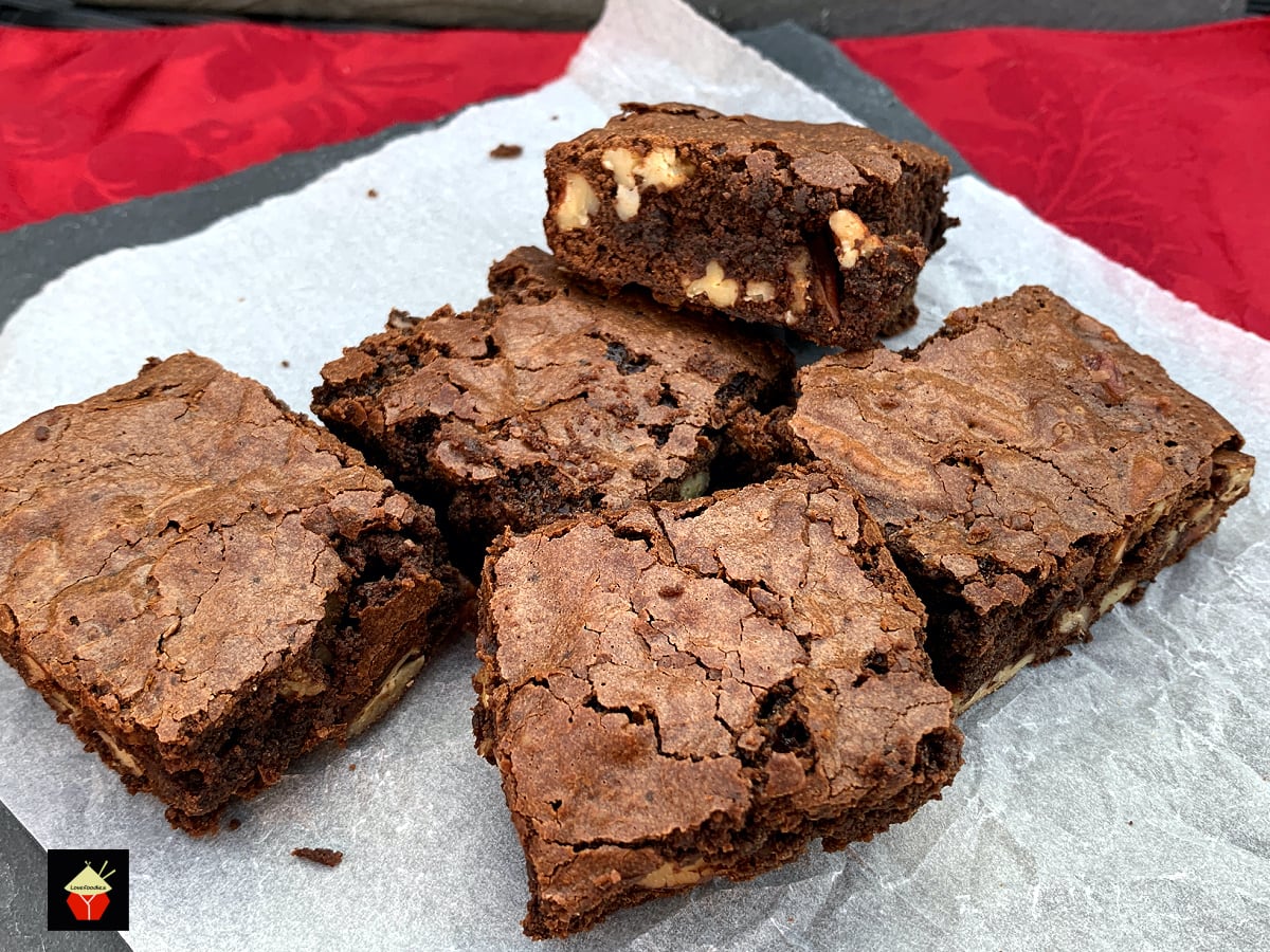 Triple Chocolate Pecan Brownies. These chewy soft brownies have a classic crisp outer, loaded with chocolate and pecan nuts. A sinfully rich chocolate dessert perfect for chocolate lovers