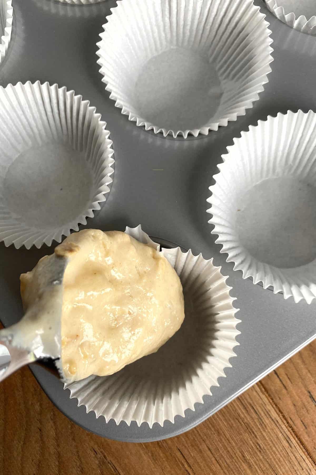 Fluffy Cherry Oatmeal Breakfast Muffins, adding batter to muffin pan Fluffy Cherry Oatmeal Breakfast Muffins, adding batter to muffin pan
