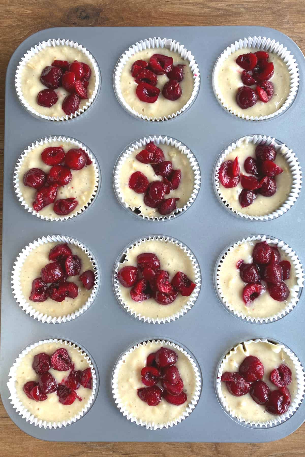 Fluffy Cherry Oatmeal Breakfast Muffins, adding cherries to batter Fluffy Cherry Oatmeal Breakfast Muffins, adding cherries to batter
