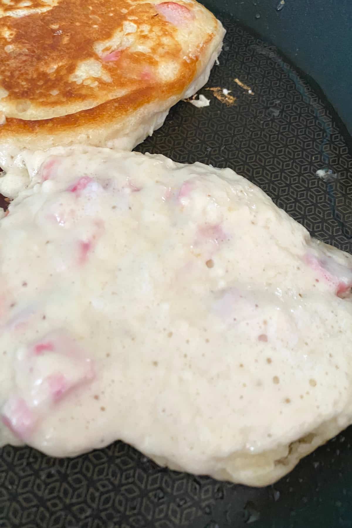 Fluffy Rhubarb Pancakes, showing bubbles in pancake Fluffy Rhubarb Pancakes, showing bubbles in pancake