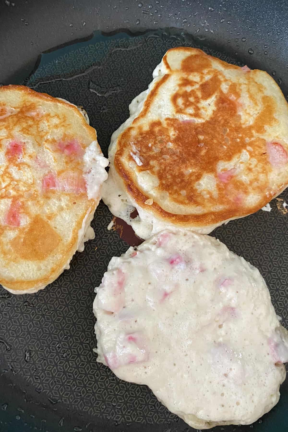 Fluffy Rhubarb Pancakes, showing when to turn pancakes over Fluffy Rhubarb Pancakes, showing when to turn pancakes over