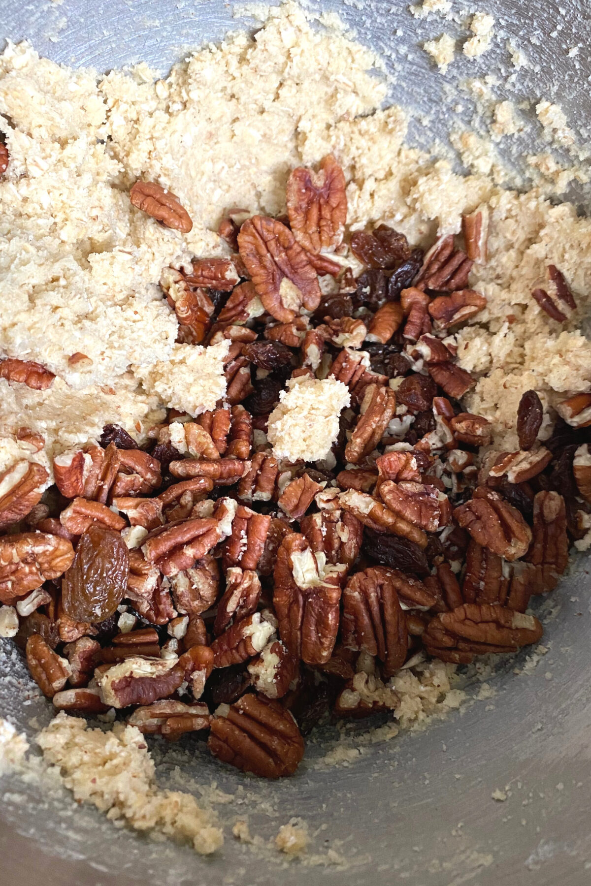 Pecan and Raisin Oatmeal Cookies, adding pecans and raisins to batter Pecan and Raisin Oatmeal Cookies, adding pecans and raisins to batter