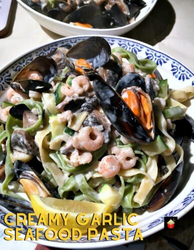 Creamy Garlic Seafood Pasta, a delicious quick and easy meal, shrimp and mussels with a delicious creamy white wine sauce.