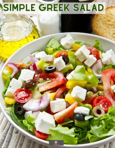 This Simple Greek Salad is full of flavor. Cucumber, tomatoes, lettuce, feta cheese, olives and onion combined with a delicious lemon and herb salad dressing.