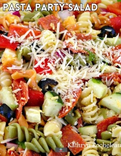 Pasta Party Salad is a great salad dish to take to a party, potluck, or BBQ. A mix of peppers, zucchini, olives,& tomatoes, all coated in a delicious cheese dressing