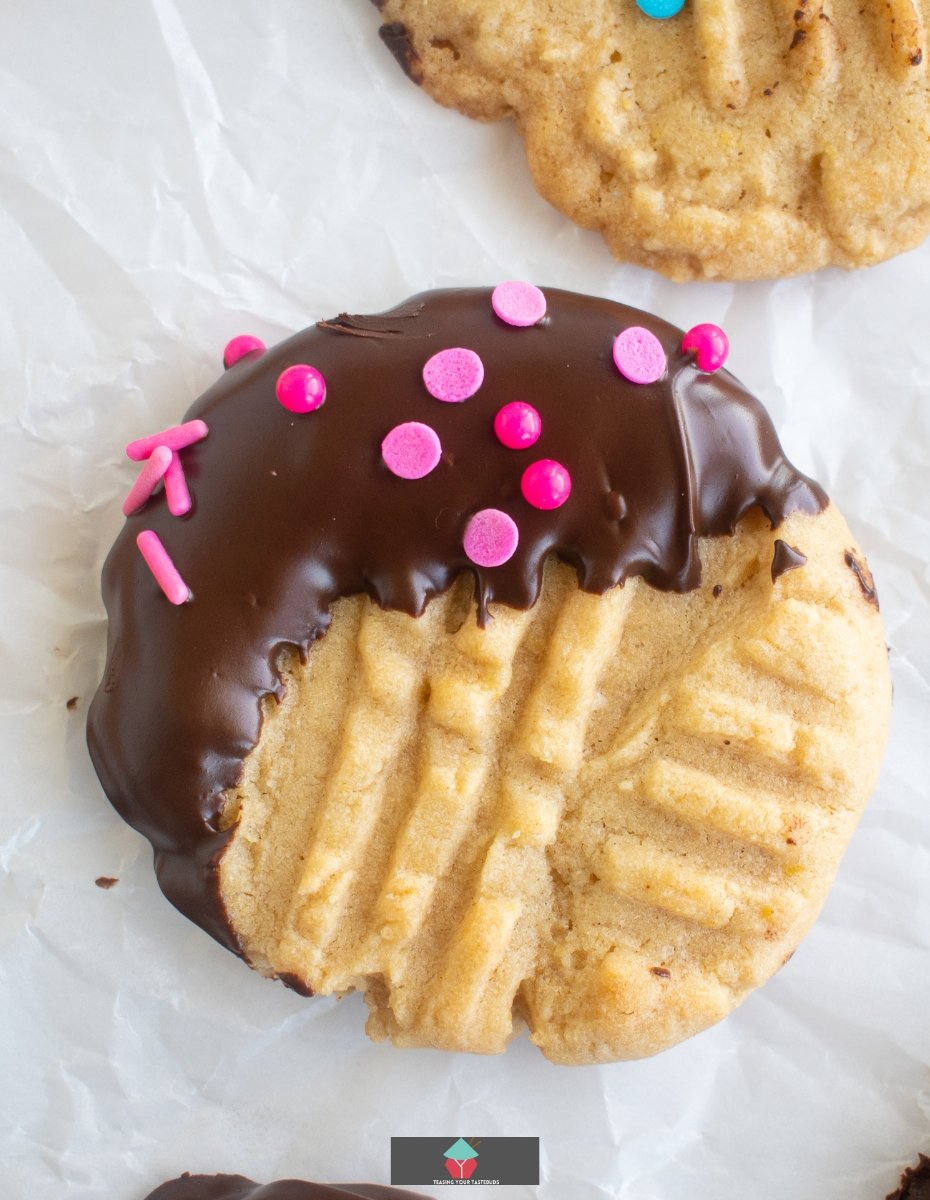 Chocolate Dipped Peanut Butter Cookies Chocolate Dipped Peanut Butter Cookies, showing cookie dipped in chocolate with sprinkles added