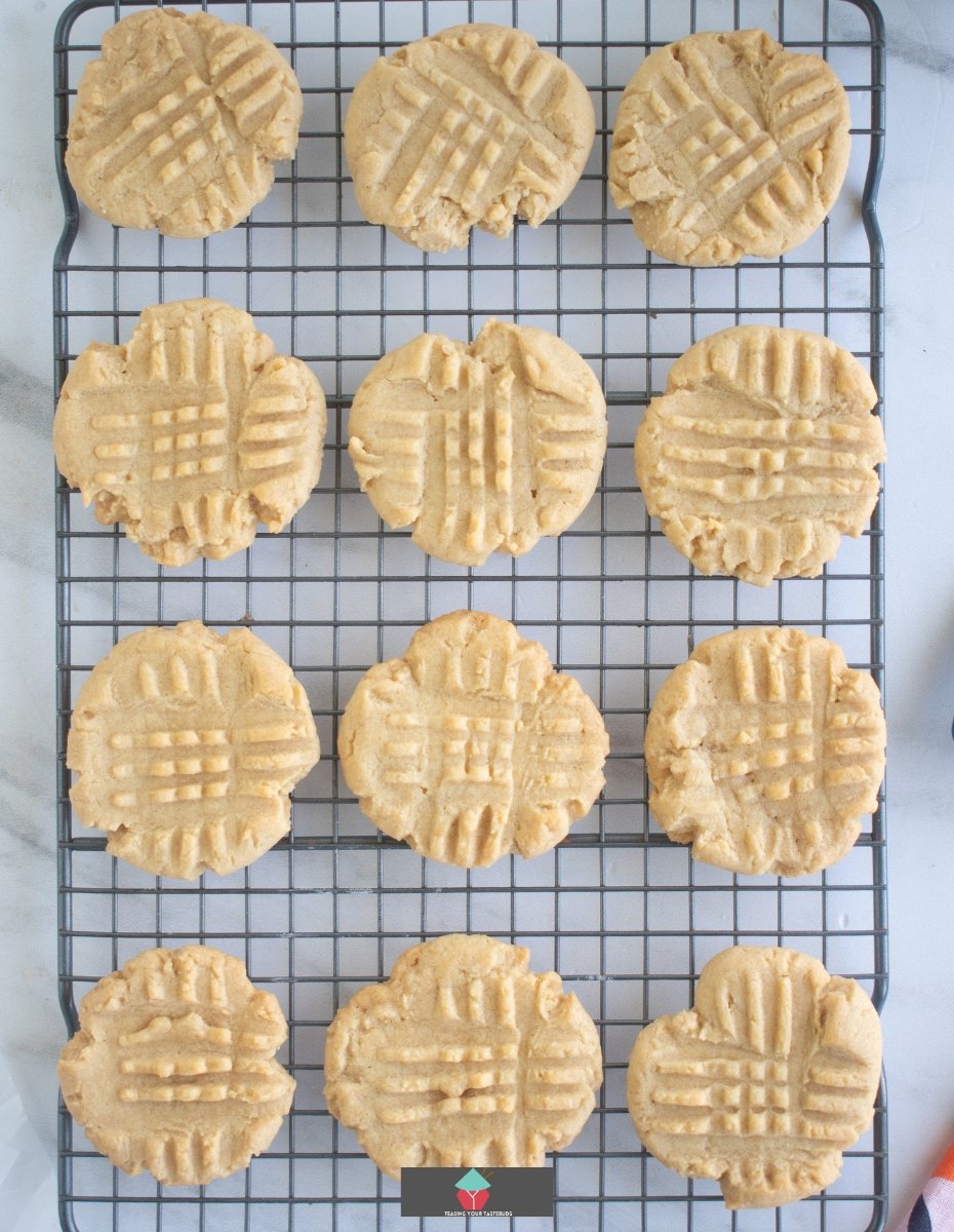 Chocolate Dipped Peanut Butter Cookies, showing cookies on the cooling rack after baking Chocolate Dipped Peanut Butter Cookies, showing cookies on the cooling rack after baking