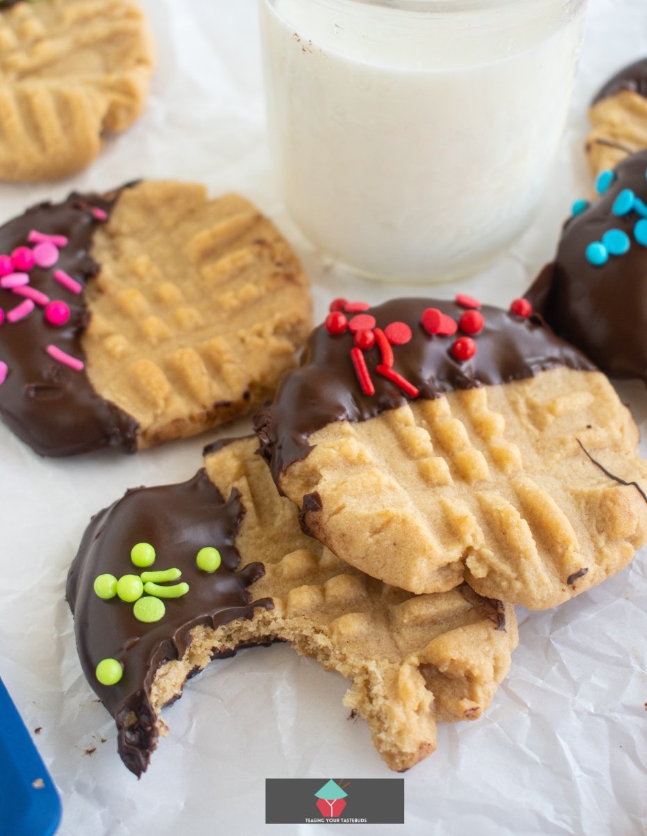 Chocolate Dipped Peanut Butter Cookies Chocolate Dipped Peanut Butter Cookies Classic peanut butter cookies dipped in chocolate and covered in sprinkles are delicious with a cold glass of milk. Creamy, crunchy and full of flavor. Easy recipe too!