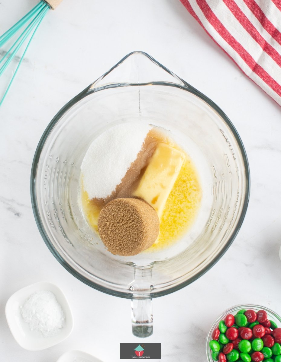 Crispy Chocolate M&M Cookies, adding butter and sugars Crispy Chocolate M&M Cookies, adding butter and sugars